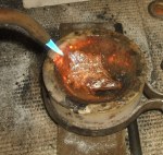 MHD scrap sterling silver in crucible beginning to melt